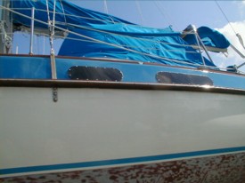 Port side work completed, new ports and paint between toe and rub rails